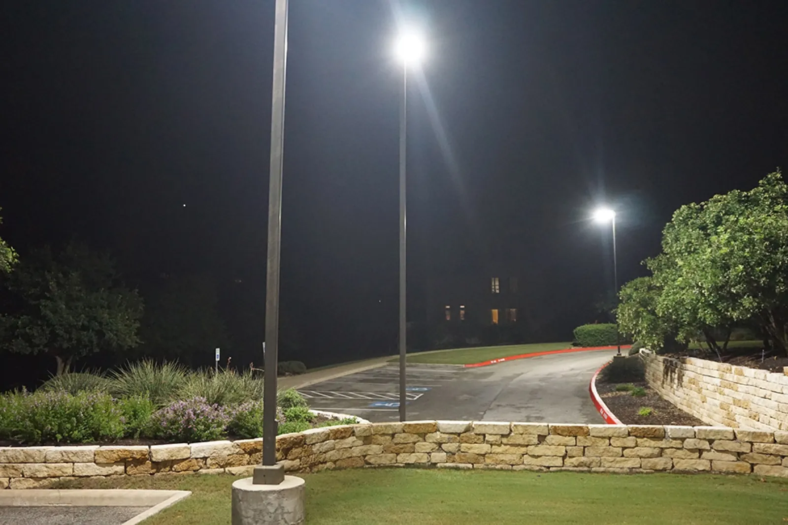 LED parking lot and area lighting at a Texas commercial property at night